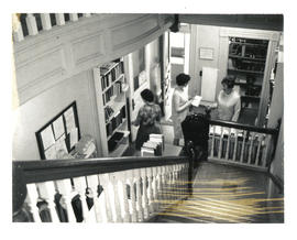 Photograph of library staff and patron in Medical-Dental Library - 5963 College Street