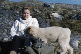 Photograph of Barbara Hinds and a dog in Frobisher Bay, Northwest Territories