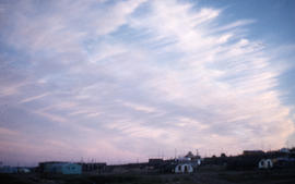Photograph of the sky above a group of houses in Frobisher Bay, Northwest Territories