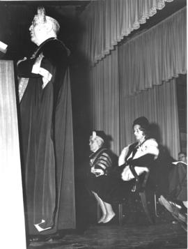 Photograph of Lady Dunn and others on stage at the opening ceremony of the Sir James Dunn Building