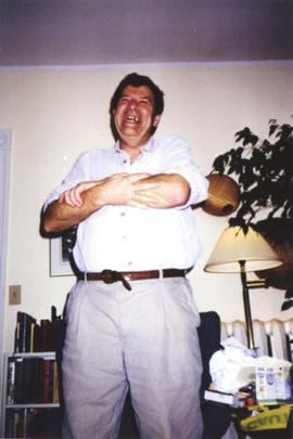 Photograph of Bill Owen standing at his farewell party