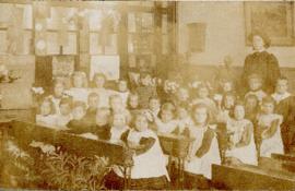 Portrait of the children and teacher of Class III printed on a postcard