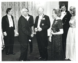 Photograph of Thomas Head Raddall chatting with Governor General Roland Michener and his wife, No...