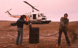 Photograph of Bill Freedman and Bill Gizyn spraying oil at a Cape Parry control site, Northwest T...