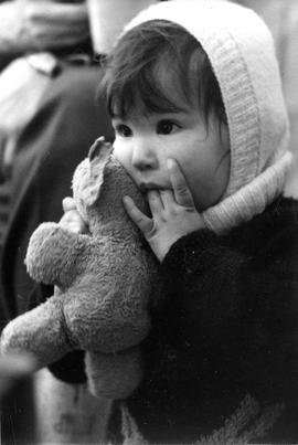 Photograph of an unidentified girl holding a teddy bear