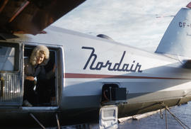Photograph of Barbara Hinds on an airplane in Fort Chimo, Quebec