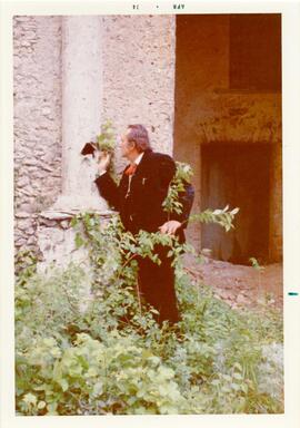 Photograph of a man in Castello dell Abate by P. Dohrn