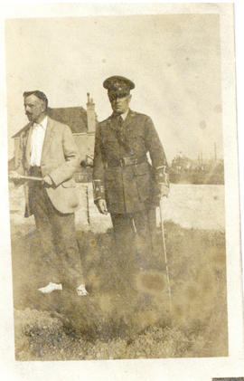 Photograph of T.H. Raddall, Sr. in uniform while on leave in England standing with a gentleman in...