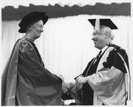 Photograph of Henry Hicks presenting a degree