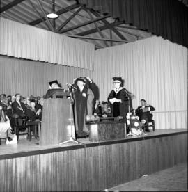 Photograph of an unidentified person receiving an honorary degree