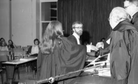 Photograph of two law students being presented with awards