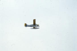 Photograph of an RCMP airplane in flight
