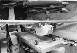 Photograph of Ken Beaver with model airplane