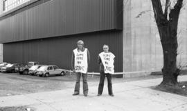 Photograph of two members of CUPE 1392 on strike