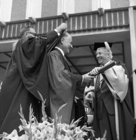 Photograph of Dr. Leonard A. Miller receiving an honorary degree