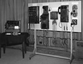 Photograph of early telephone switchboards and intercommunication telephones used in warehouses a...