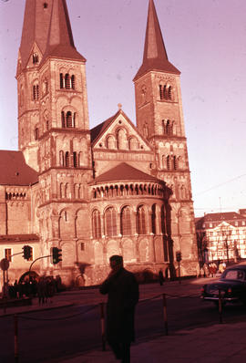 Photograph of the Bonn Minster with unidentified man in front