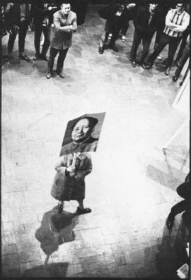 Photograph of a Maoist student, protesting alone in the foyer of the Dalhousie Student Union Buil...