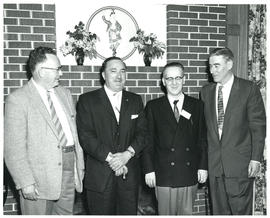 Photograph of four people at miscellaneous unknown health-related event