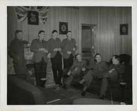 Photograph of Richard Roome and six unidentified officers sitting in the Black Watch mess, Sussex...
