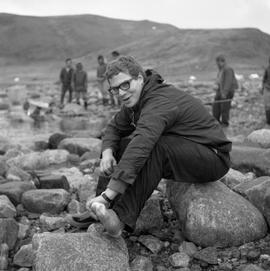 Photograph of Bob Preston sitting on a rock in northern Quebec