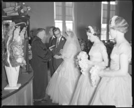 Photograph of Mr. & Mrs. Grice and their wedding party at the wedding ceremony