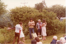 Photograph of Charlie Murray and Nolan Reilly conversing with unidentified attendees of the First...