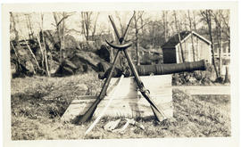 Photograph of a sword, two rifles, a horn, and a 4-pound cannon, likely from the privateer Rover