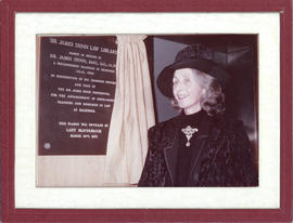 Photograph of Lady Beaverbrook with a plaque in honour of Sir James Dunn