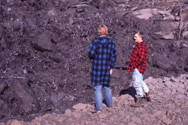 Photograph of Tom Hutchinson and another unidentified researcher examining tailings at the Copper...