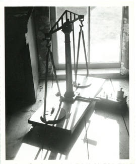 Photograph of a scale and weights used at the Whiteburn mine at Molega, Nova Scotia