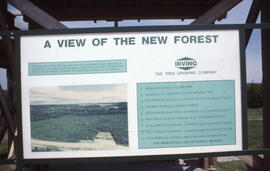 Photograph of an Irving plantation sign with panorama image and legend, near Fundy National Park,...