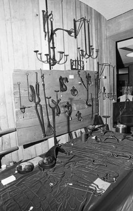 Photograph of a stand selling wrought iron goods at a craft market