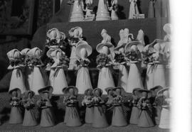 Photograph of a stand selling ceramic figurines at a craft market