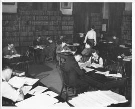 Photograph of people working in the law library in the Forrest Building