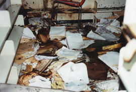 Photograph of piles of damaged documents from the 1998 Killam fire
