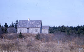 Photograph of a boarded-up house in northern Quebec
