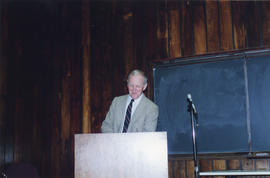 Photograph of archivist Charles Armour giving a speech at his retirement party