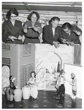 Photograph of Dixie Pelluet and others using marionettes