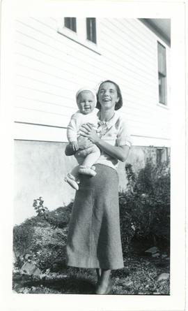 Photograph of Edith Raddall holding her son Tommy, aged 14 months