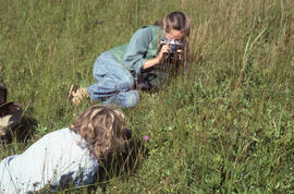 Photograph of Zoe Lucas and Noreen Stadey photographing grasses on Sable Island