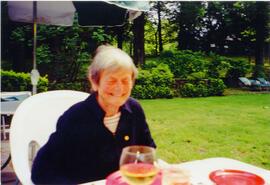 Photograph of Elisabeth Mann Borgese at a patio table