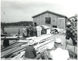 Photograph of men gathering at the Sheet Harbour pulp mill at the end of the dam