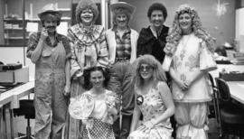 Photograph of circulation staff in costume