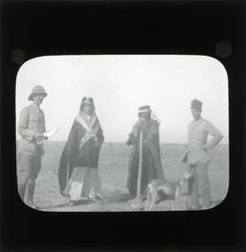 Photograph of soldiers and a dog