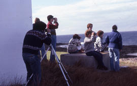 Photograph of Bill Freedman using binoculars on Brier Island, Nova Scotia