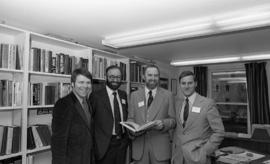Photograph of four unidentified people at the opening of the Ocean Studies house