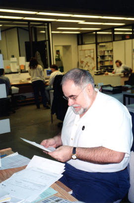 Photograph of Serge Lachapelle in the Circulation Department of the Killam Memorial Library