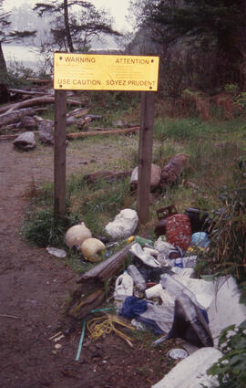 Photograph of a warning sign and persistent litter in the Tobeatic Wilderness Area, southwestern ...