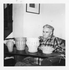 Photograph of life member Ralph Strong doing his leather and basket weaving